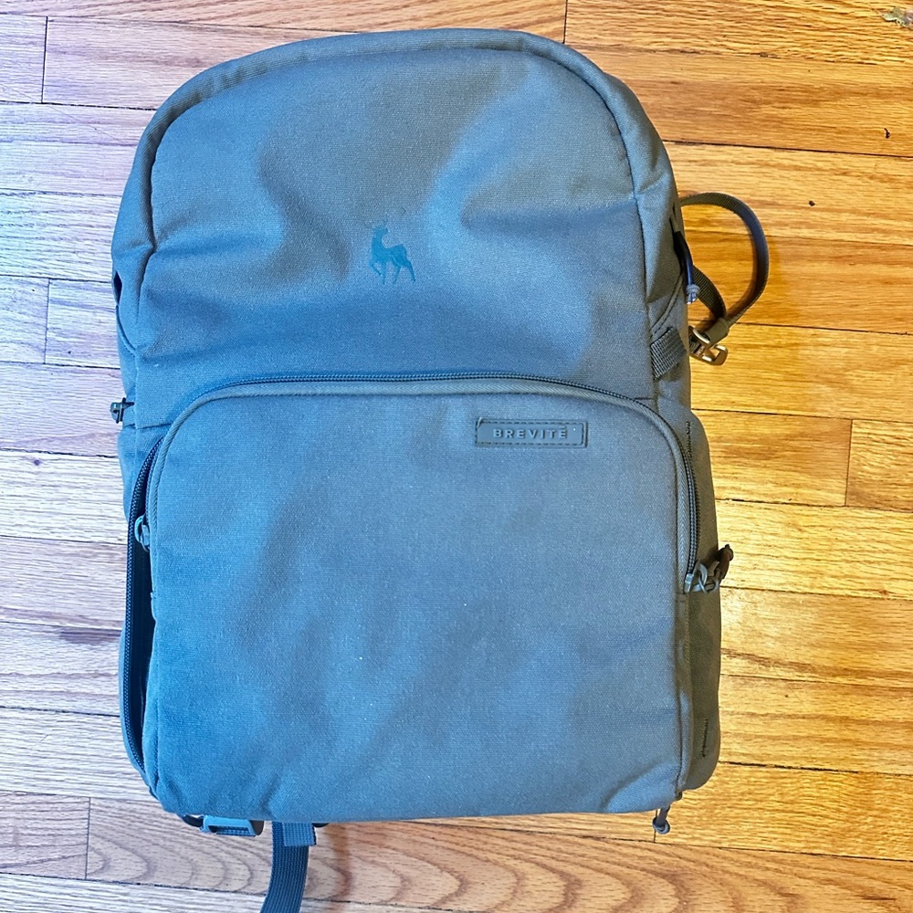 Green brevite camera backpack.